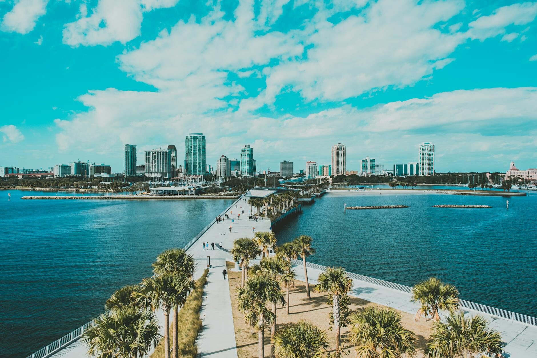 Aerial view of the St. Pete Pier with downtown St. Petersburg skyline and Gulf water